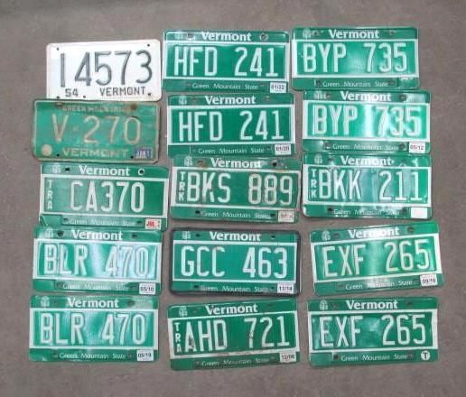 Collection of Vermont license plates, mostly green and white, displayed on a neutral background.