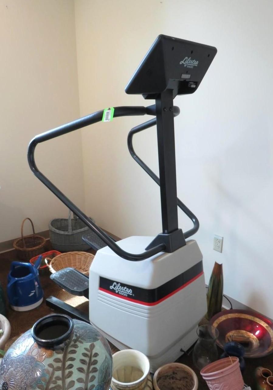 Gray and black Life Fitness stepper exercise machine.