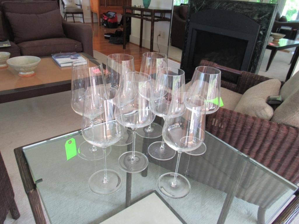 Wine glasses on a glass table.