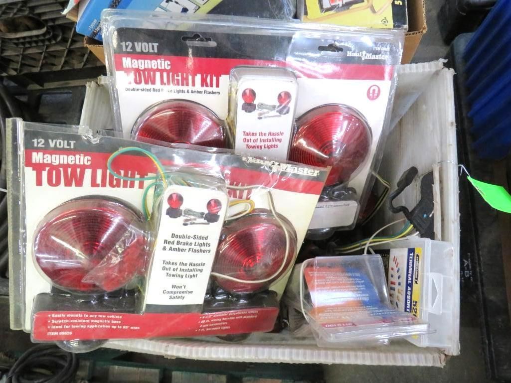 Box of 12-volt magnetic tow light kits, red lights, white packaging.