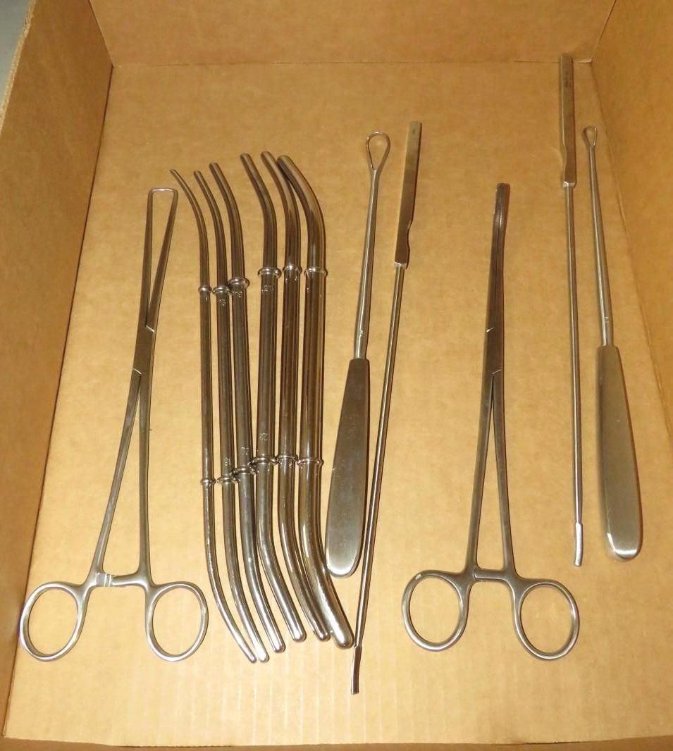Medical surgical instruments in a cardboard box.