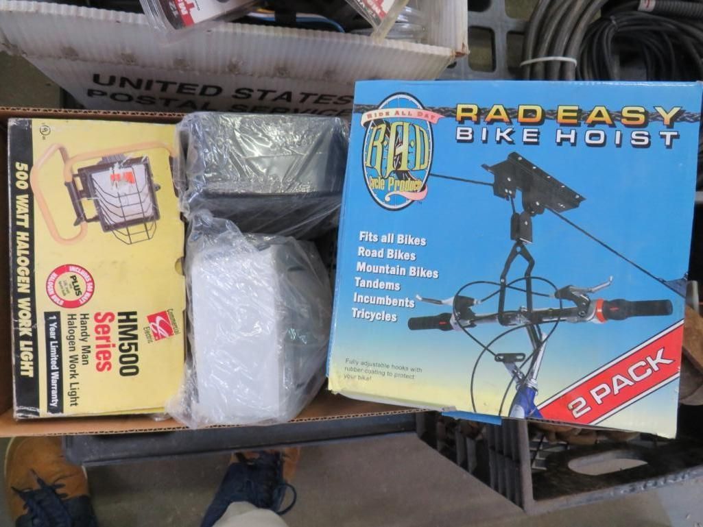 Boxes of goods, including a bike hoist and a 