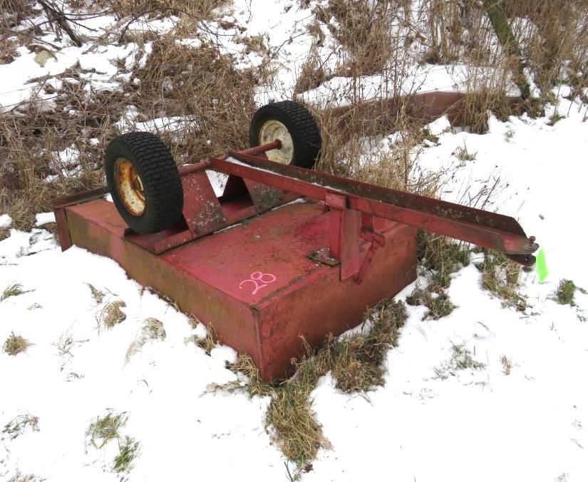 Red rotary mower on wheels.
