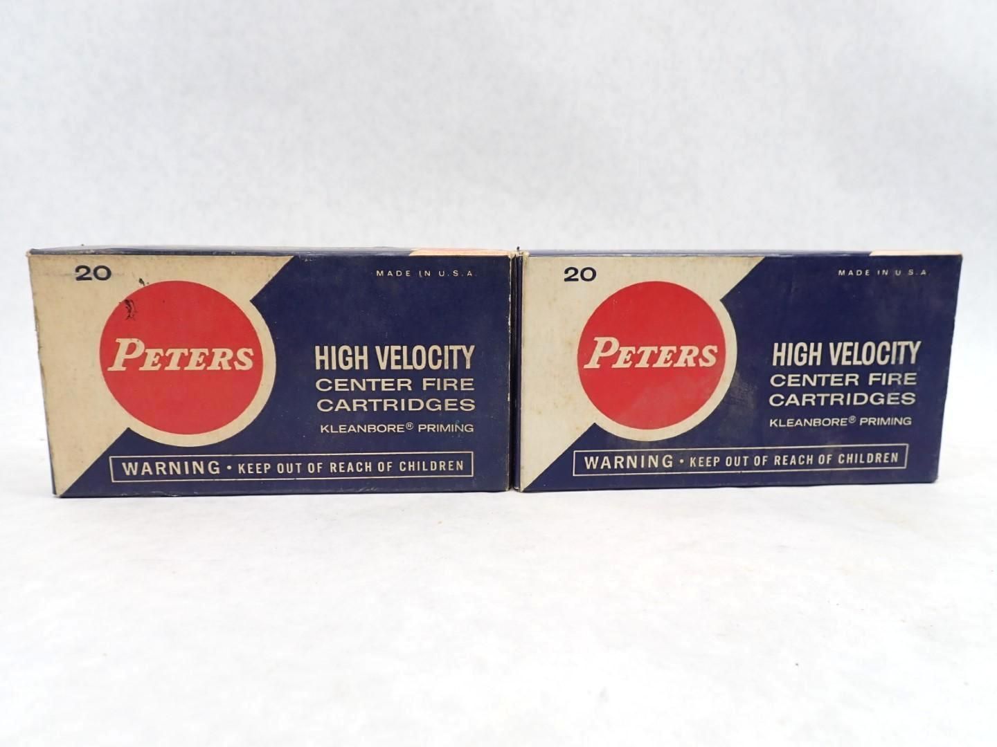 Two boxes of Peters High Velocity Center Fire Cartridges, cream and navy blue with a red circle logo.