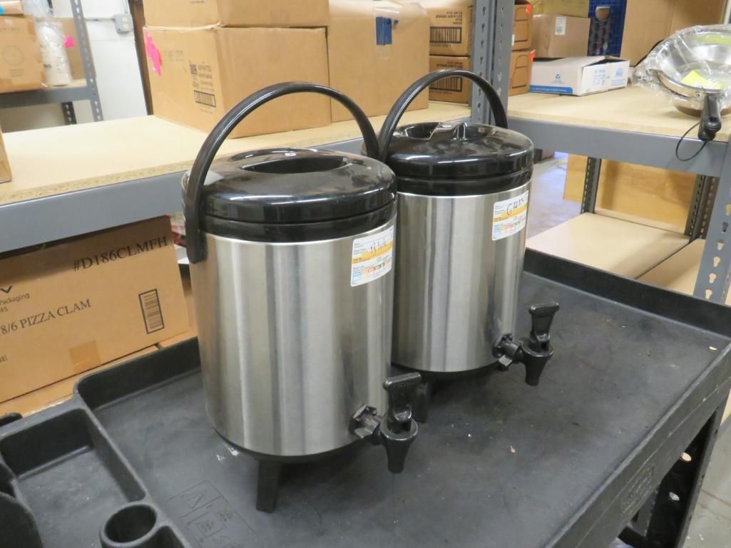 Two stainless steel insulated beverage dispensers with black lids and spouts.