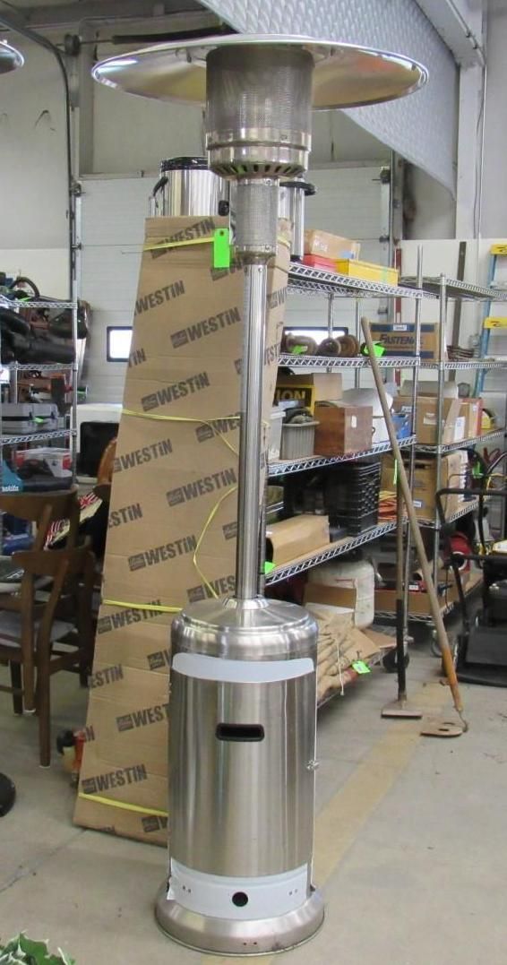 Tall, stainless steel patio heater.