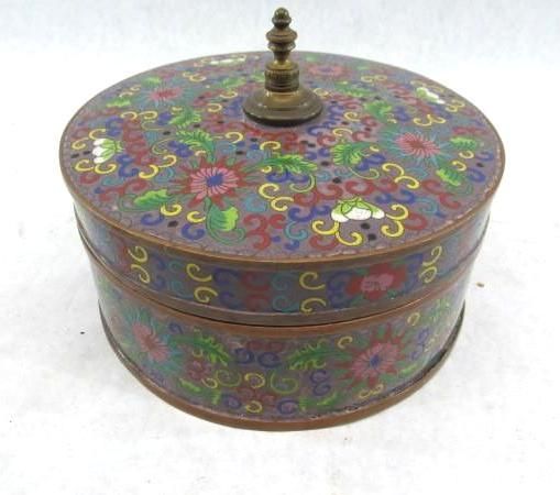 Round cloisonné box with floral design and brass finial.