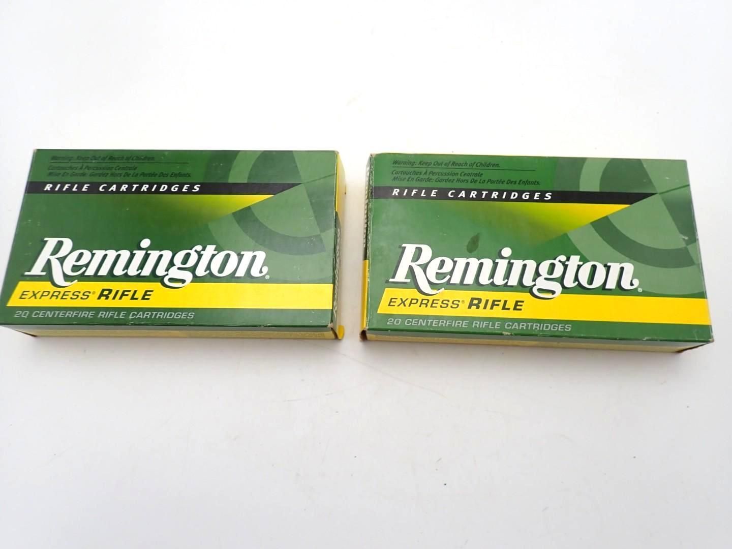 Two green Remington rifle ammunition boxes on a white surface