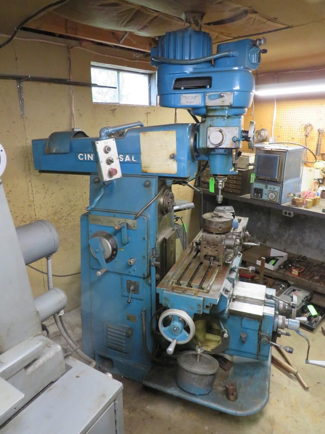 Blue Cincinnati milling machine in a workshop.