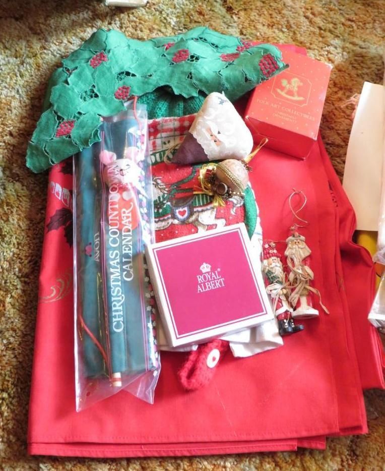 Christmas decor: red tablecloth, Royal Albert box, ornaments, advent calendar, green lace.