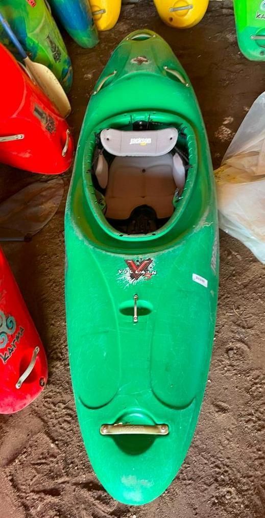 Green whitewater kayak with internal seating, and a front and rear carry handle.