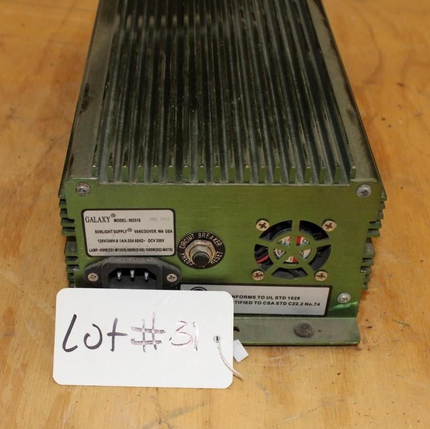 Green Galaxy power supply unit with a fan and a white tag labeled