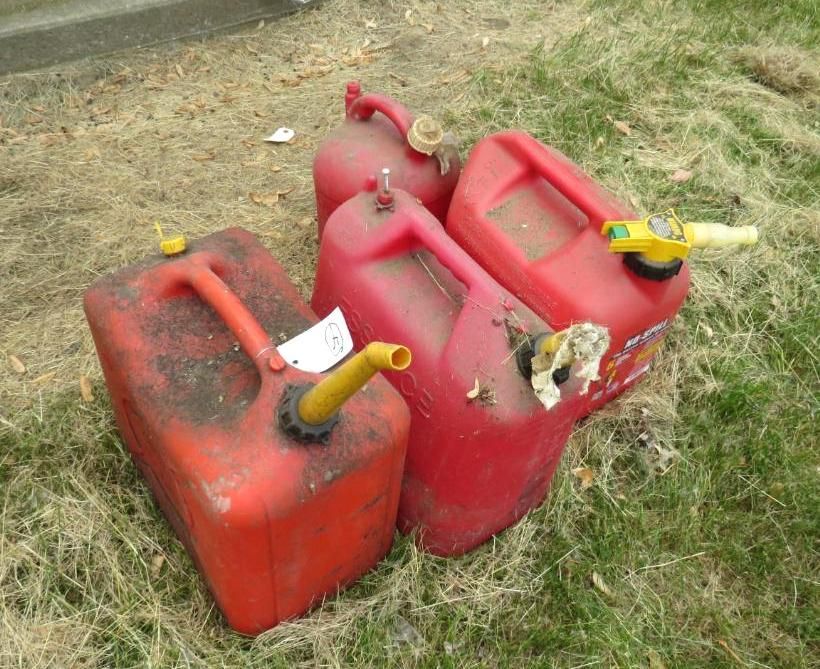 Four red gas cans.