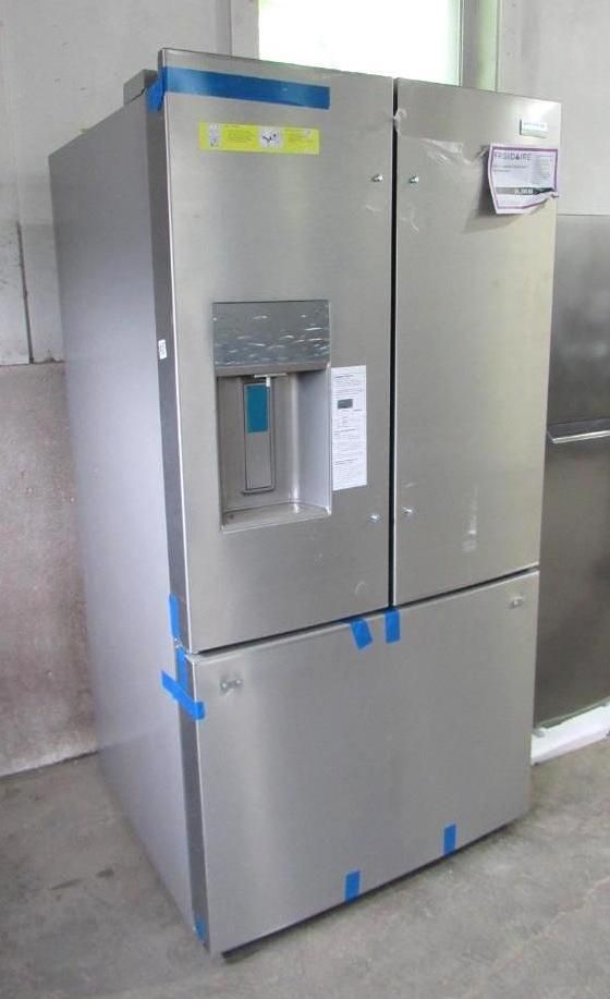 Stainless steel French door refrigerator with water dispenser.