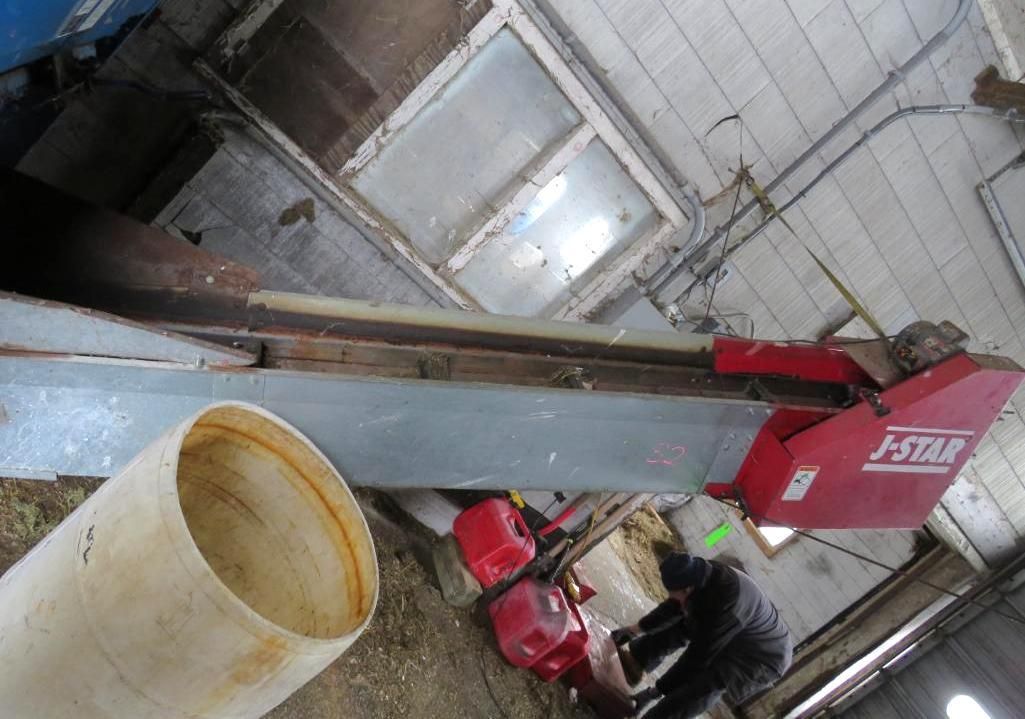 Red J-STAR band saw in a workshop.