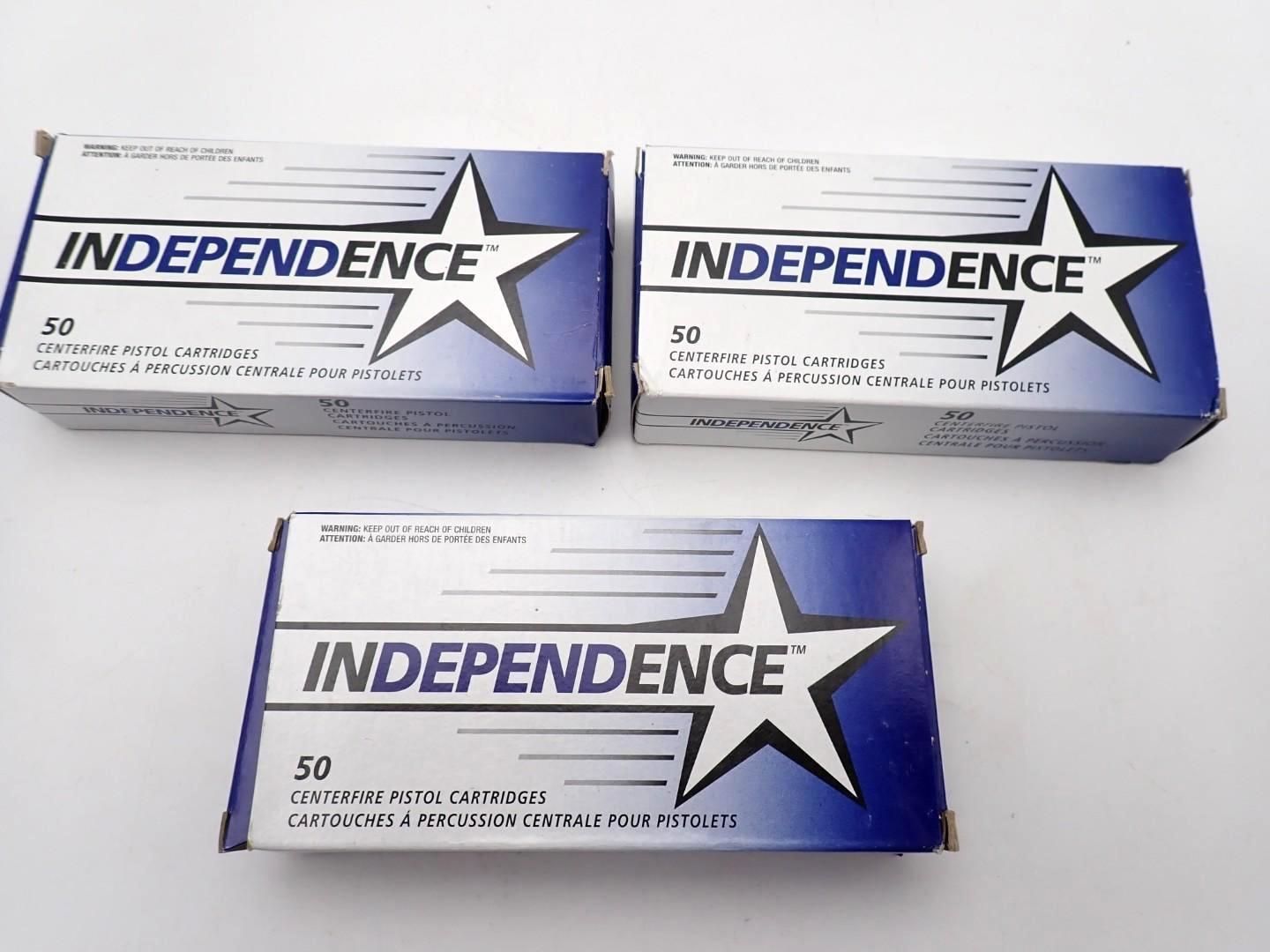 Three blue-and-white Independence ammo packs arranged in a triangle on a white surface