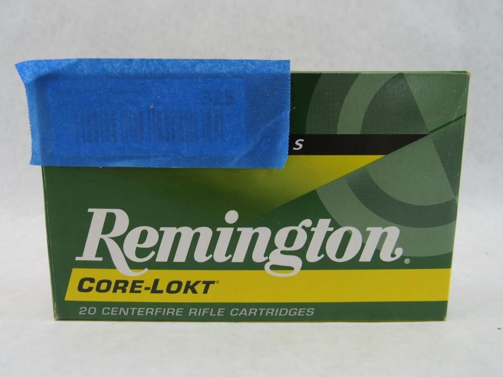 Box of Remington Core-Lokt rifle cartridges; green box with blue tape on top.