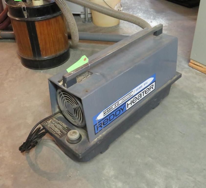 Gray Reddy Heater with a fan, attached hose, and power cord.