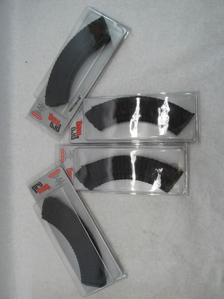 Four packages containing curved, black items.