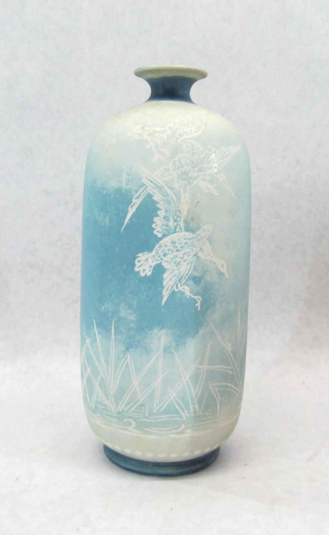 Blue and white etched glass vase; turtle and plant design.