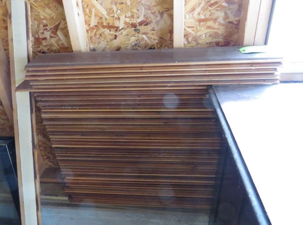 Stack of wooden flooring planks.