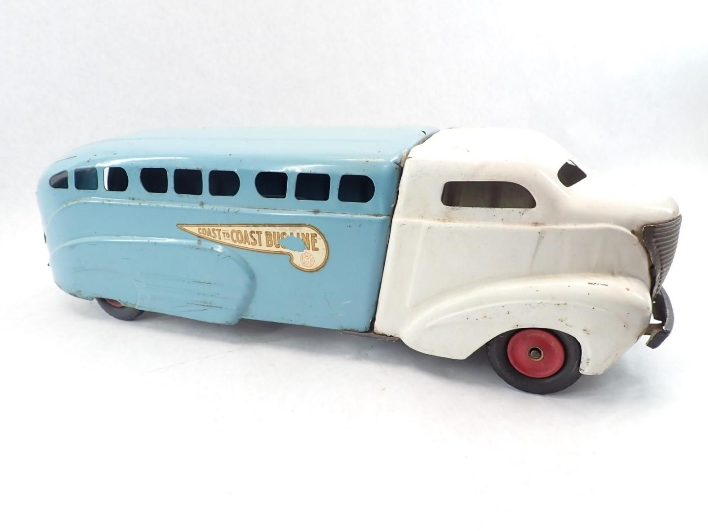 Vintage toy truck, blue passenger section, white cab, red wheels,