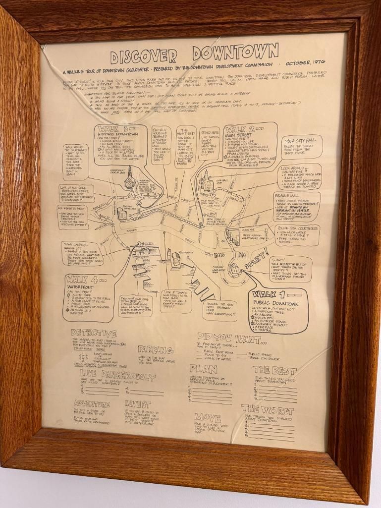 Framed document with handwritten notes and diagrams, likely a historical map or process flowchart, within a wooden frame.