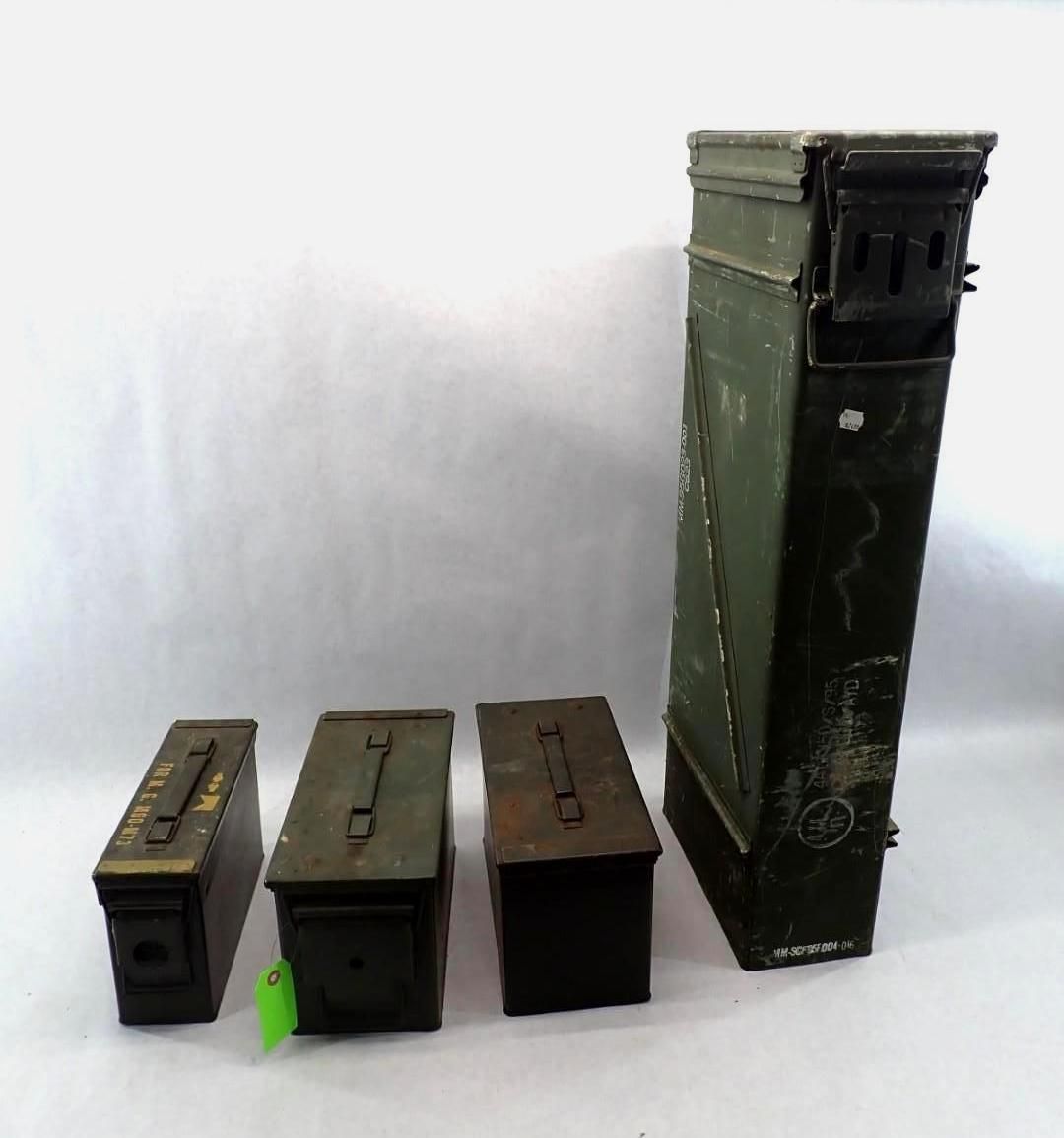 Four green ammunition boxes of varying sizes on a white background.