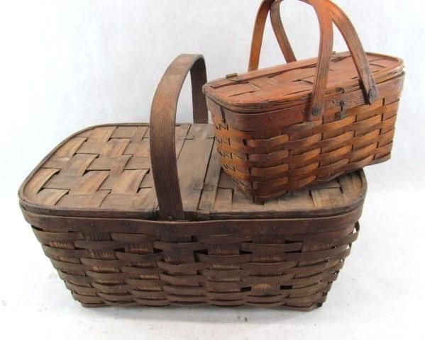 Two antique woven wooden baskets; one large with a handle and lid, the other smaller with a handle.
