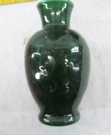 Green glazed ceramic vase with a bulbous body and narrow neck.