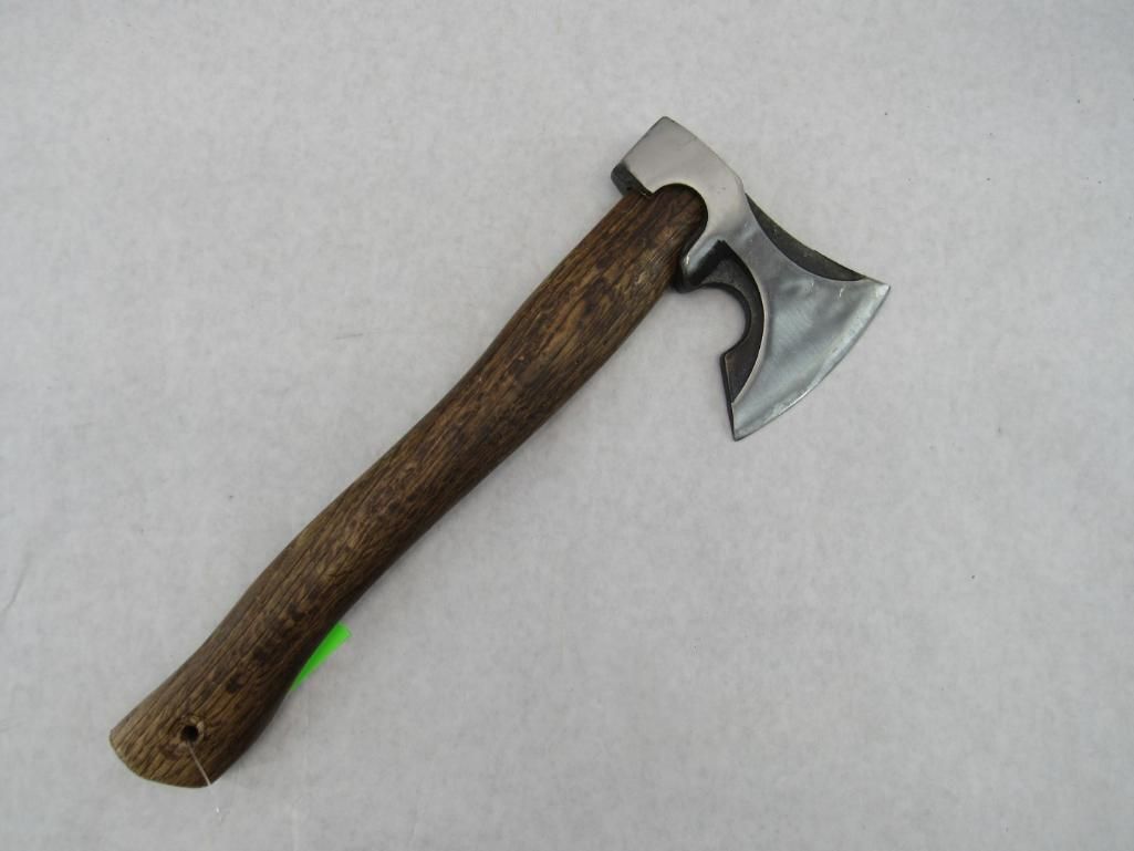 Axe with a wooden handle and a metal blade.