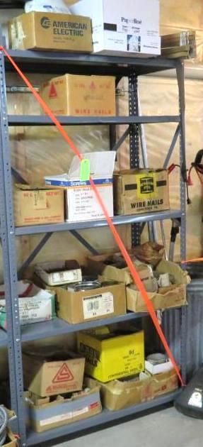 Metal shelving unit filled with cardboard boxes of varying sizes and colors.