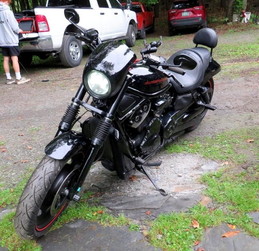 Black Harley Davidson motorcycle parked outdoors.