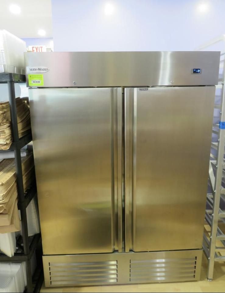 Stainless steel commercial refrigerator with two doors.