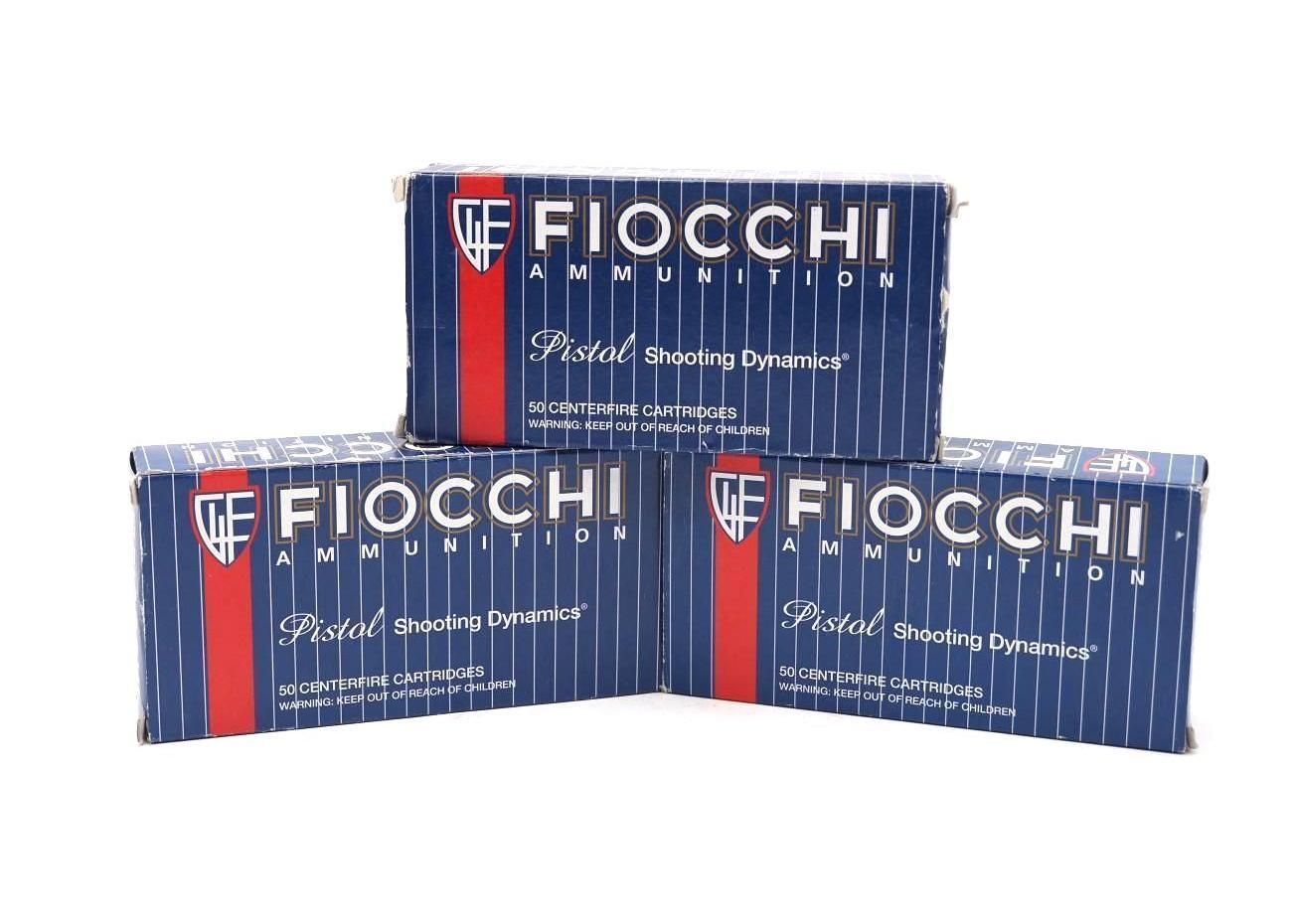 Three Fiocchi branded blue and red ammunition boxes stacked on a white background