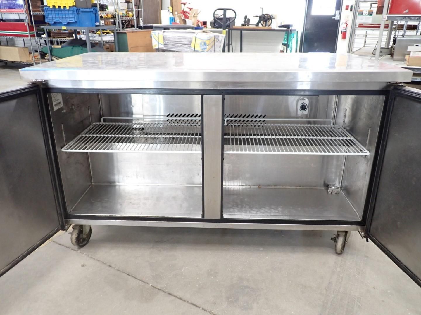 Stainless steel commercial refrigerator with open doors, shelves, and wheels.