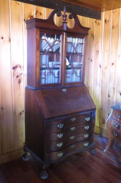 Antique wooden secretary desk with glass-fronted bookcase, sloping desk, and drawers.