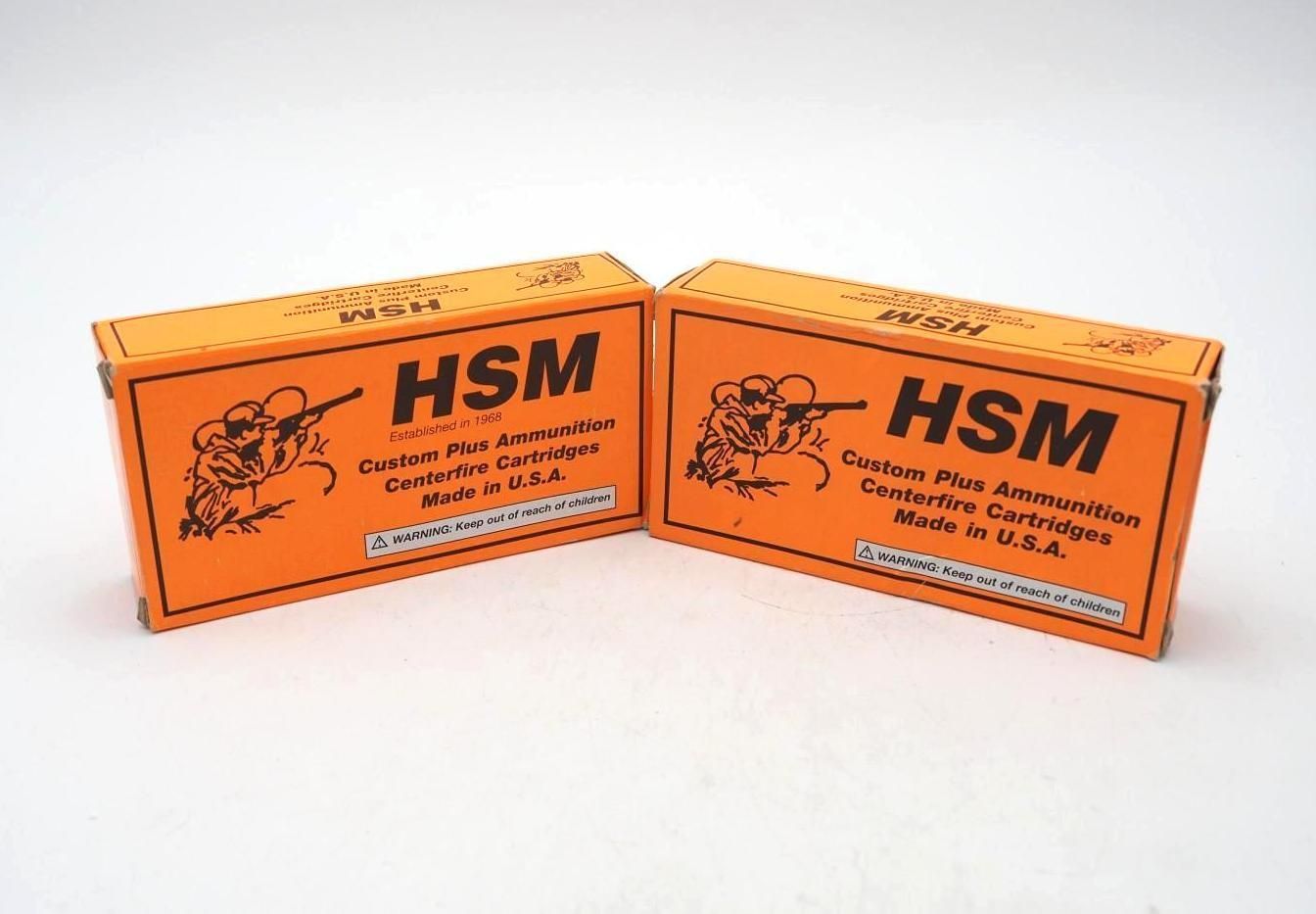 Two orange HSM cardboard boxes with black text, shown side by side on a white background