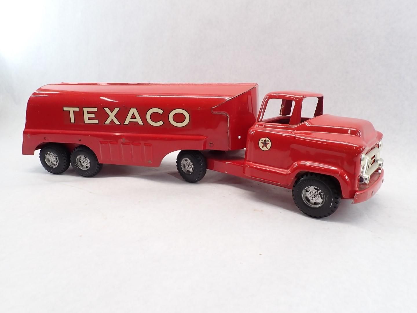 Vintage red Texaco tanker truck toy.