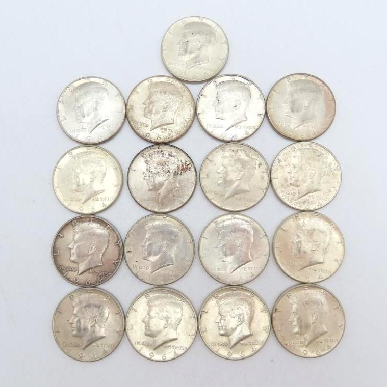 Twenty silver Kennedy half-dollar coins arranged in a square and triangle formation.
