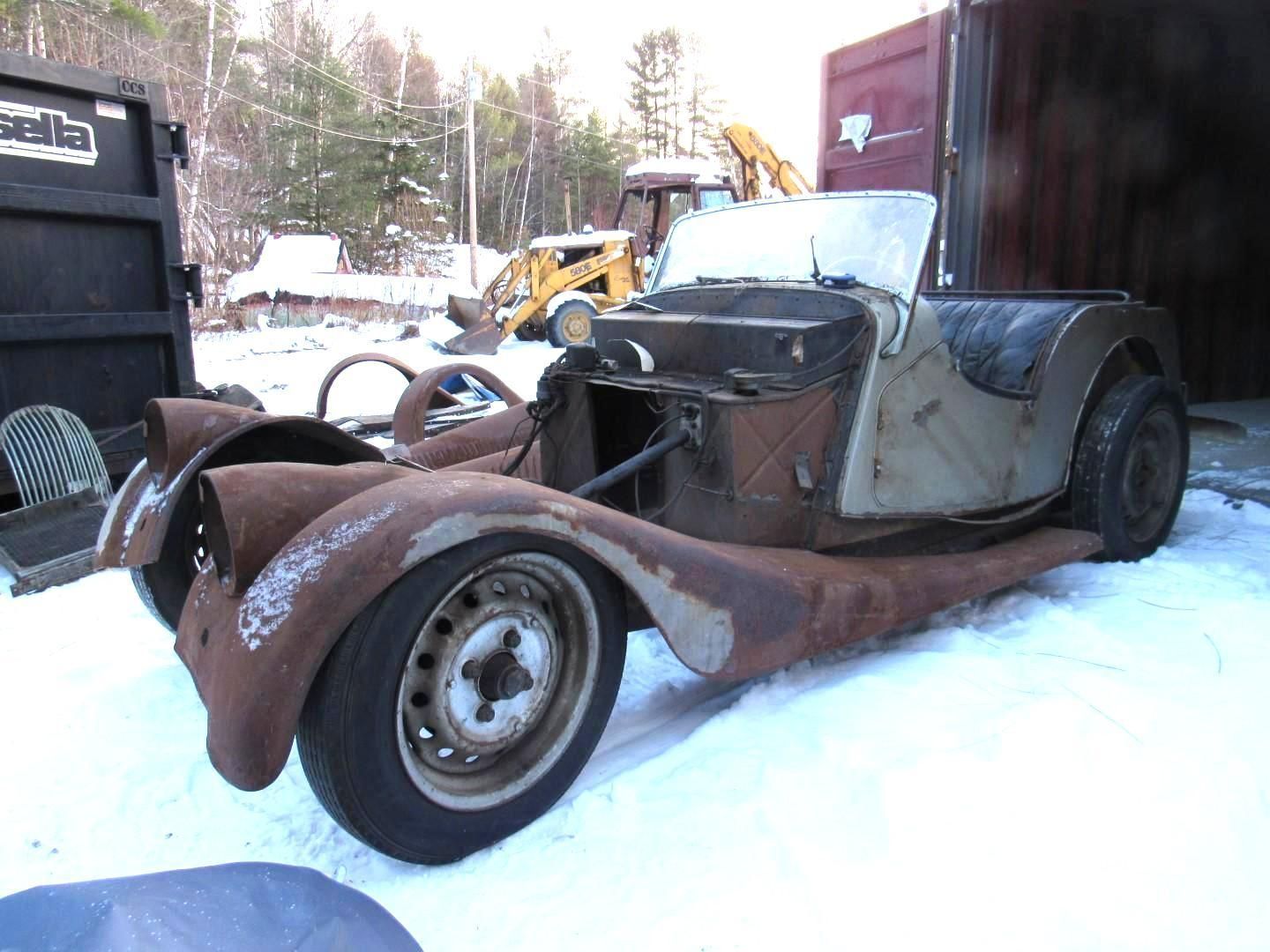 Vintage sports car frame and body.
