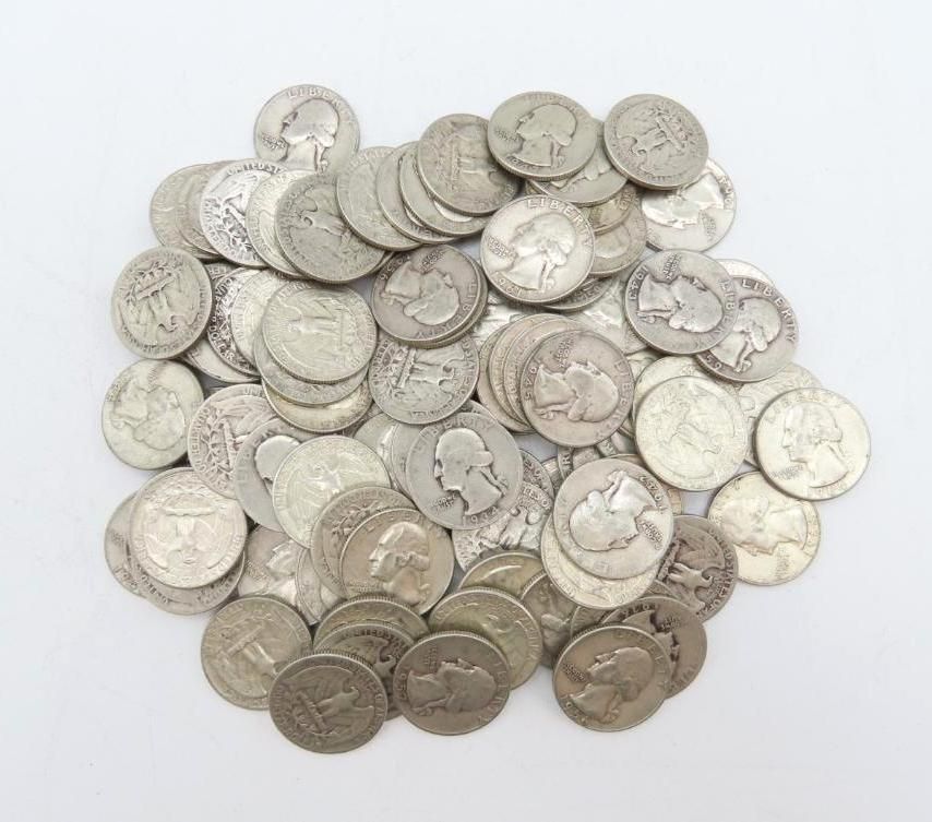 Pile of silver coins, mostly quarters, on a white background.