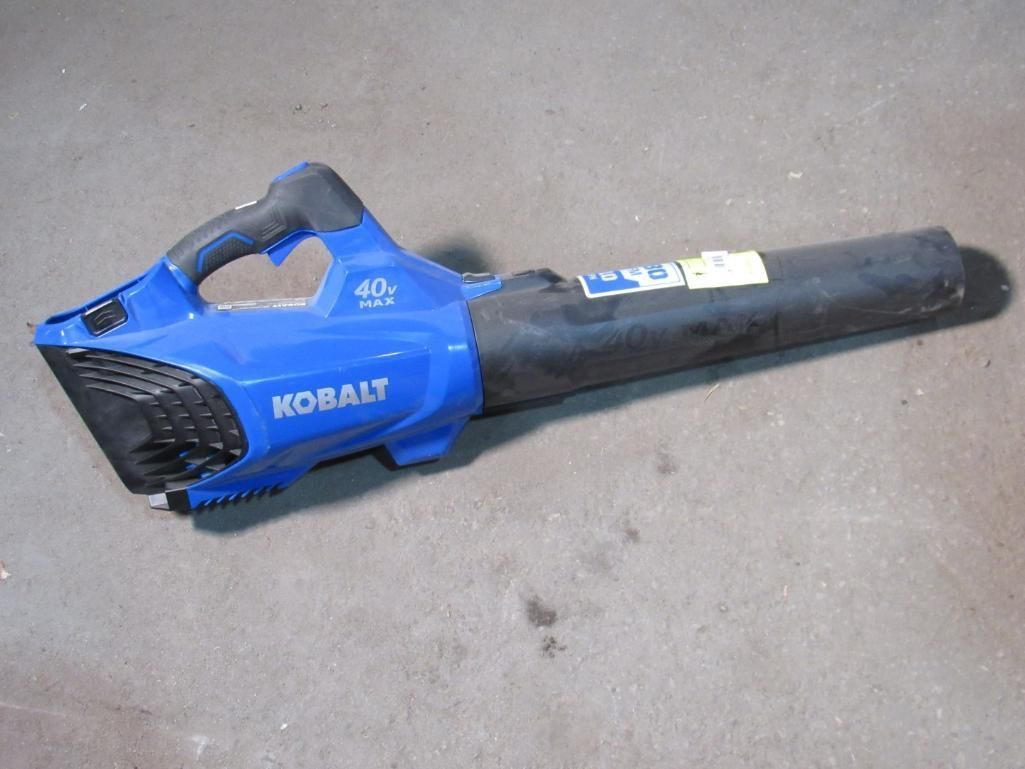 Blue and black Kobalt handheld leaf blower on a concrete surface.