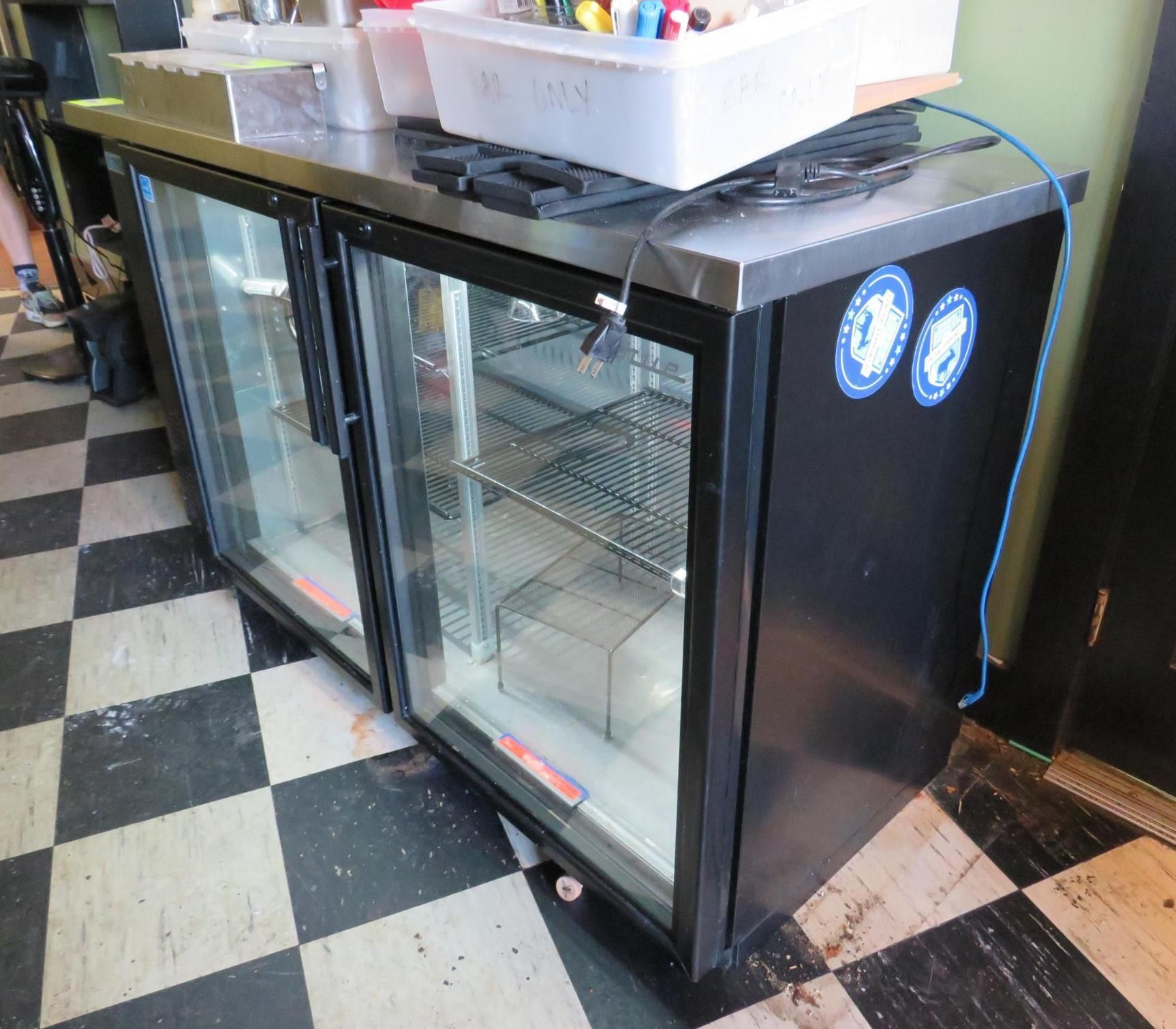 Black commercial refrigerator with glass doors.