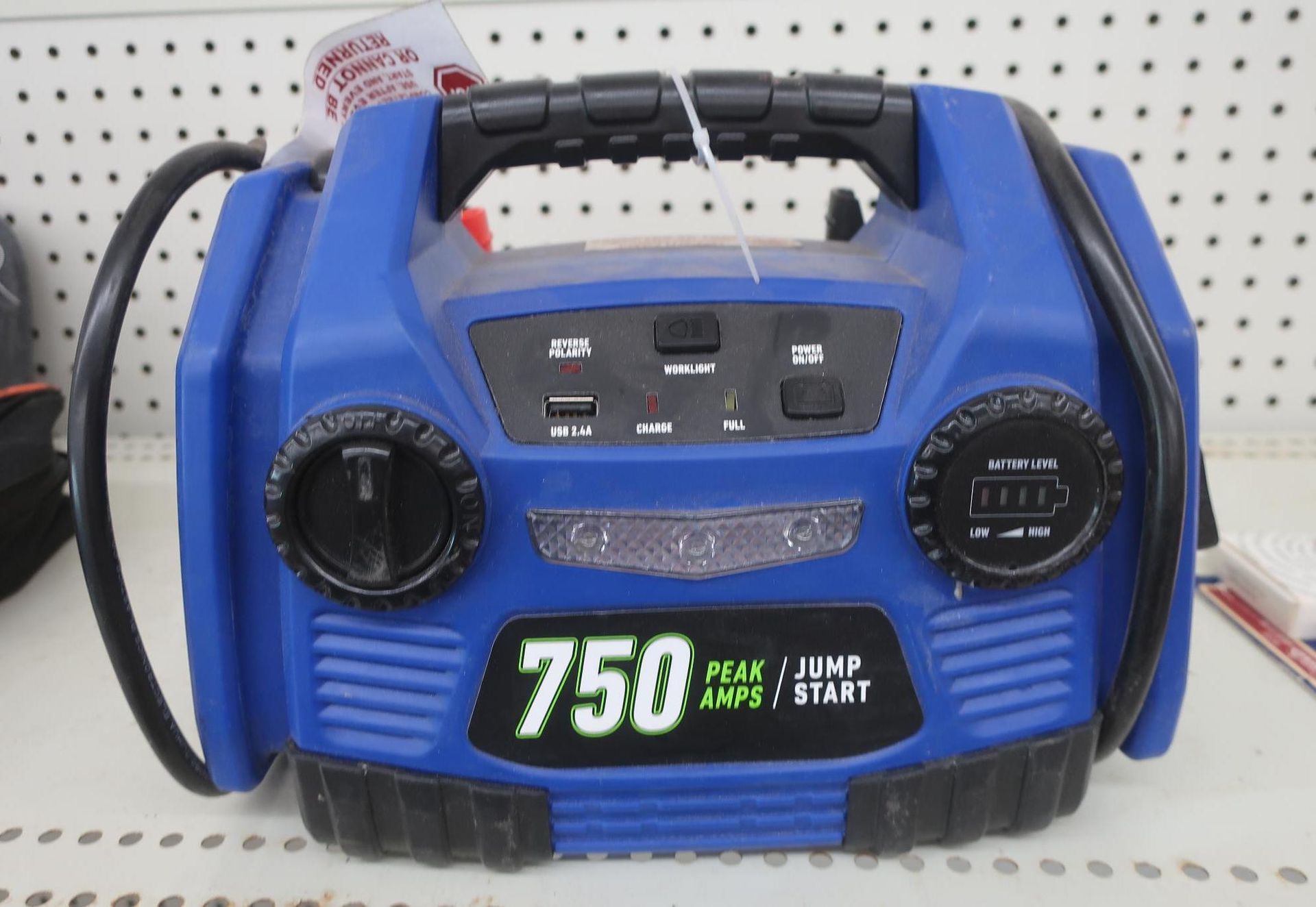 Blue 750 peak amp jump starter with handle, controls, and battery gauge.