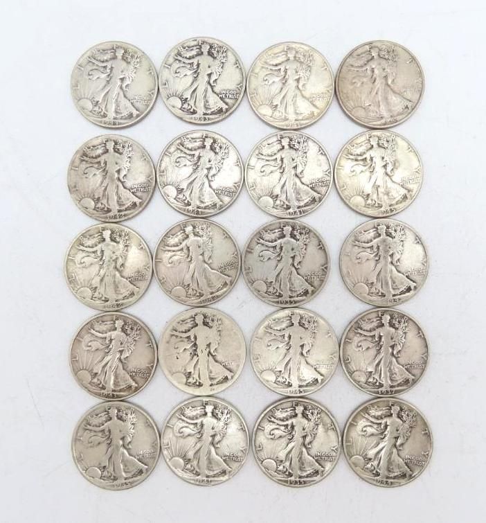 Twenty silver Walking Liberty half dollars arranged in a rectangle. Each coin depicts the iconic Lady Liberty.