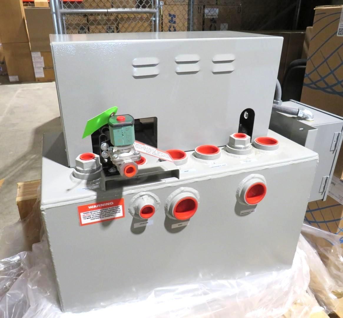 Gray industrial machinery with red-capped ports and green valve.