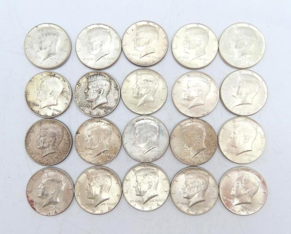 Twenty silver Kennedy half-dollar coins, arranged in a grid, showing the profile of John F. Kennedy.