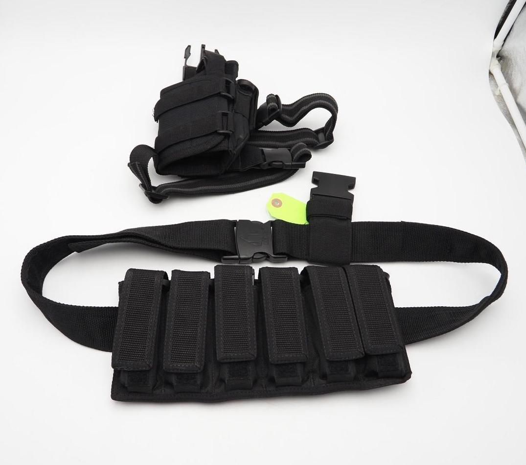 Black tactical belt with pouches and a matching black holster on a white background