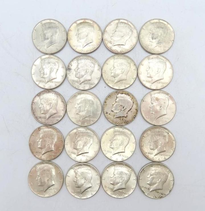 Twenty silver half-dollar coins arranged in a square on a white surface. The obverse side is visible.
